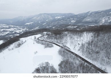 Aerial view of snowy mountain winter white landscape Vezzolacca , Emilia Romagna, Italy - Powered by Shutterstock