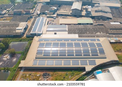 Aerial View Of Solar Panels Or Solar Cells On The Roof Of Factory Building Rooftop. Power Plant, Renewable Clean Energy Source. Eco Technology For Electric Power In Industry.