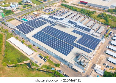 Aerial View Of Solar Panels Or Solar Cells On The Roof Of Shopping Mall Building Rooftop. Power Plant, Renewable Clean Energy Source. Eco Technology For Electric Power In Industry.