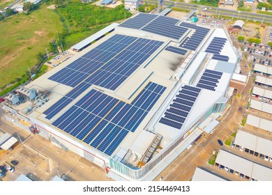 Aerial View Of Solar Panels Or Solar Cells On The Roof Of Shopping Mall Building Rooftop. Power Plant, Renewable Clean Energy Source. Eco Technology For Electric Power In Industry.