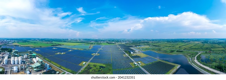 Aerial view of Solar Panels Farm (solar cell). Drone flight fly over solar panels field renewable green alternative energy concept in Thailand. solar energy. power plant.