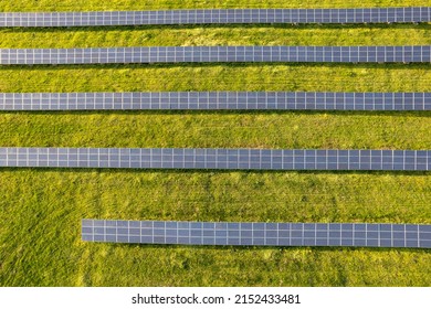 aerial view of solar panels on a sunny day. power farm producing clean energy - Shutterstock ID 2152433481