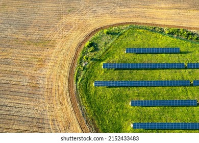 aerial view of solar panels on a sunny day. power farm producing clean energy - Shutterstock ID 2152433483