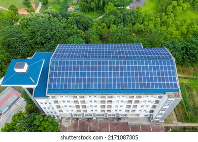 Aerial View Of The Solar Panels On  Dormitory Building Roof With Park Green Space