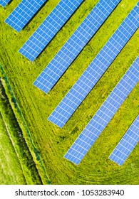 Aerial View Of Solar Panels. Renewable Solar Energy Theme For Background. Solar Power Station From Drone View.