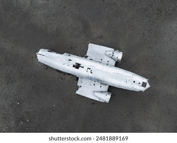 Aerial view of the Solheimasandur Plane Wreck in Iceland. Wrecked old plane Dakota on the black sand beach, south coast of Iceland - Powered by Shutterstock