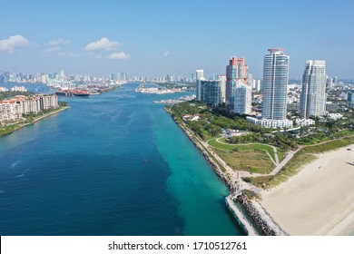 Aerial view of South Pointe Park and South Beach in Miami Beach, Florida devoid of people under coronavirus pandemic beach and park closure.
