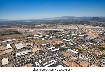 Aerial view of south Tucson, Arizona with mixed use business, industrial, travel and international airport with Green Valley and Mexico in the extreme distance