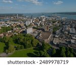 Aerial view of Southampton city center with green park. Panoramic view towards the sea, Southampton port and Itchen toll bridge.