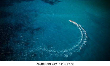 Aerial View Of Speed Boat In Motion. Water Transportation And Summer Leisure Time Activity.