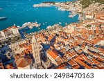 Aerial view of Split, Croatia. Cityscape of coastal touristic city with harbor. Old town with historical red roof tiled buildings near Adriatic Sea