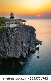 An aerial view of Split Rock Lighthouse at a scenic golden sunrise, highlighting the historic landmark and stunning coastal beauty