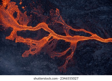 Aerial view of spreading melted lava from volcano. Beautiful natural forces creating abstract background. Litli Hrutur, Fagradalsfjall, Iceland July, 2023.