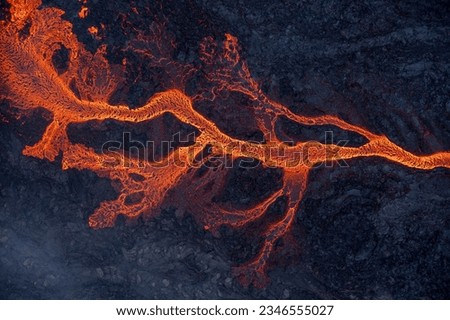 Aerial view of spreading melted lava from volcano. Beautiful natural forces creating abstract background. Litli Hrutur, Fagradalsfjall, Iceland July, 2023.