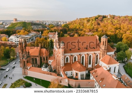 Aerial view of St. Anne Church and neighbouring Bernardine Church, one of the most beautiful and probably the most famous buildings in Vilnius. Beautiful autumn day in the capital of Lithuania.