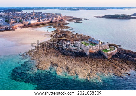 Aerial view of St Malo town walls and the National Fort on atlantic coast of Brittany, France