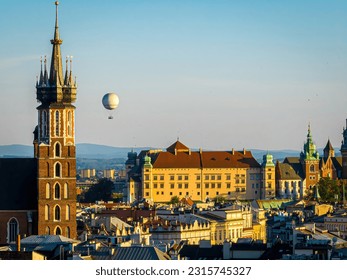 Aerial view of St. Mary's Basilica in Krakow with air baloon on the background, Poland, Europe