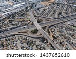 Aerial view of streets, buildings and traffic along the 880 freeway at 98the Ave in Oakland California.