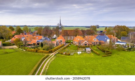 Aerial view of streets in hamlet of Niehove historical dwelling mound Village, Groningen Province, the Netherlands. Monumental scene in Europe.