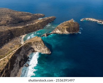 Aerial view of stunning rocky coastline with clear blue waters. - Powered by Shutterstock