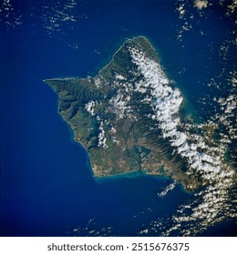 Aerial view of a stunning tropical island with white sand beaches, turquoise waters, and lush green vegetation. Explore this paradise with its dramatic cl. Elements of this image furnished by NASA - Powered by Shutterstock