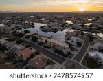 An aerial view of suburban houses at sunset. Arrowhead Lakes, Glendale Arizona