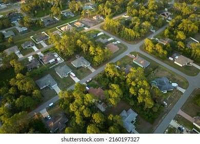 Aerial View Of Suburban Landscape With Private Homes Between Green Palm Trees In Florida Quiet Residential Area