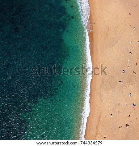 Similar – Luftaufnahme von fliegenden Drohnen von Menschen, die sich am Algarve Beach in Portugal entspannen.