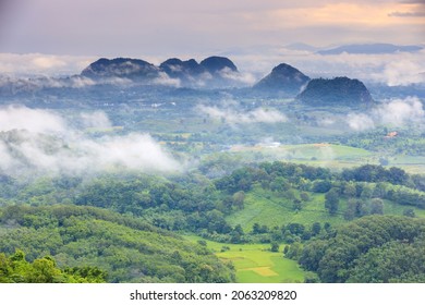 Aerial view of Sun rise with fog Over City and mountain range at Chiangrai Thailand - Powered by Shutterstock
