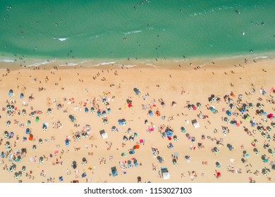Aerial view of sunbathers and umbrellas on the beach at the Jersey shore