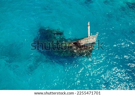 Aerial view of a sunken ship near Keyodhoo, Vaavu Atoll, Maldives, Indian Ocean. A place for tourists engaged in diving and snorkeling
