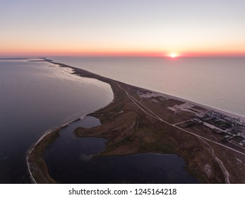 Aerial view of a sunrise over Byriuchyi Island - spit between Azov Sea and Utljuk Lyman , Azov-sivash national park, Kherson Oblast, Ukraine