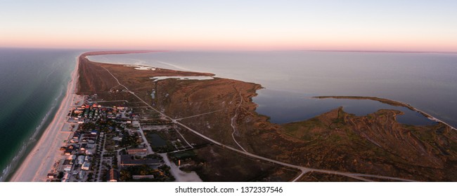 Aerial view of a sunrise over Byriuchyi Island - spit between Azov Sea and Utljuk Lyman , Azov-sivash national park, Kherson Oblast, Ukraine