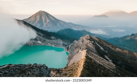 Aerial view of sunrise at a volcanic caldera, Ijen volcano crater in East Jawa, Indonesia, volcanic lake with sulphur gases at dawn, tourism in Ijen volcano national park in Jawa. - Powered by Shutterstock