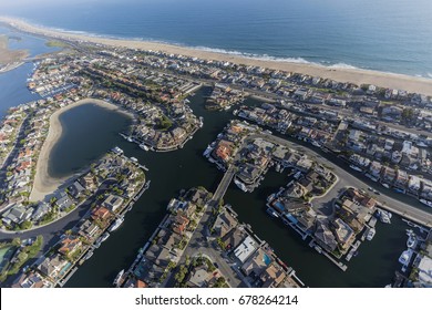 Aerial View Of Sunset Beach Waterfront Homes In Orange County California.  