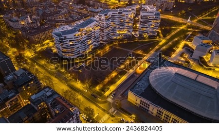 Aerial view Sunset City life Milan. Modern architecture of the city. Citylife Apartments. Zaha Hadid Architects. Night city view from above. Architecture and design concept