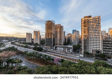 Aerial view of sunset  in Sao Paulo city, Brazil. Beggining the night in metropolis, Skyline, cars and traffic on the road - Powered by Shutterstock