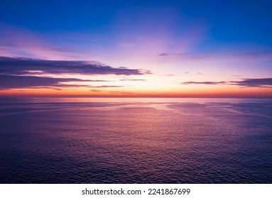 Aerial view sunset sky, Nature beautiful Light Sunset or sunrise over sea, Colorful dramatic majestic scenery Sky with Amazing clouds and waves in sunset sky purple light cloud background