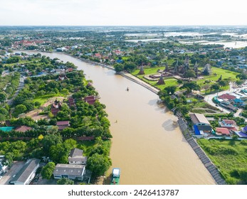 Aerial view sunset at Wat Chaiwatthanaram history travel place green grass park famous ruin temple with Chao Phraya river in Ayutthaya, Thailand - Powered by Shutterstock