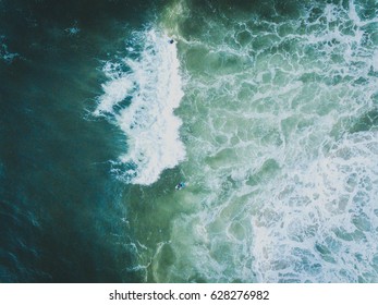 Aerial view of surfers & waves