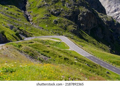 Aerial view of Swiss mountain pass road of Susten Pass with cyclist on a sunny summer day. Photo taken July 13th, 2022, Susten Pass, Switzerland. - Shutterstock ID 2187892365