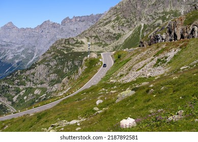Aerial view of Swiss mountain pass road with car of Susten Pass on a sunny summer day. Photo taken July 13th, 2022, Susten Pass, Switzerland. - Shutterstock ID 2187892581