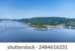 Aerial view of Tadoussac bay and Saguenay Fjord taken by drone over the St-Lawrence river. View of the Baie-Ste-Catherine, Tadoussac ferry crossing the Saguenay river and Pointe-de-L