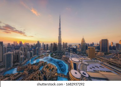 "Aerial view of tallest building in Dubai Downtown skyline and fountain - Powered by Shutterstock