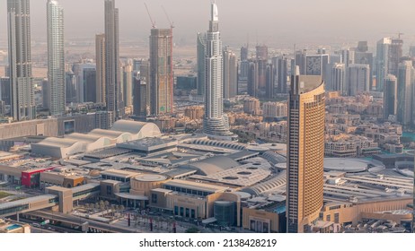 Aerial view of tallest towers in Dubai Downtown skyline timelapse. Financial district and business area in smart urban city. Skyscraper and high-rise buildings around shopping mall