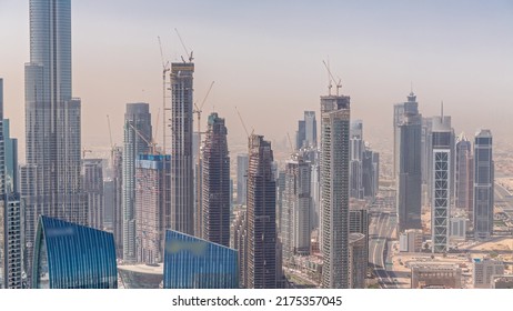 Aerial View Of Tallest Towers In Dubai Downtown Skyline And Highway Timelapse. Financial District And Business Area In Smart Urban City. Skyscraper And High-rise Buildings Under Construction