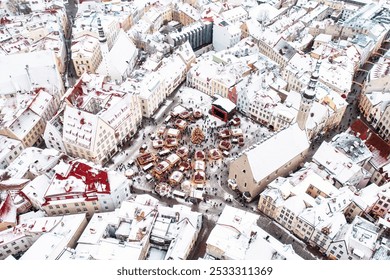 Aerial View of Tallinn Old Town the Town Hall Square in winter. View from above to the center part of capital of Estonia. Travel destination concept. Christmas mood. Roofs are covered with snow. - Powered by Shutterstock