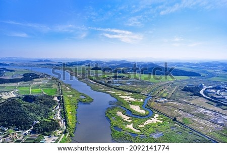 Aerial view of Tando Artificial Wetland Park and Sihwa Lake with rice field and farming village at Tando Island near Ansan-si, South Korea
