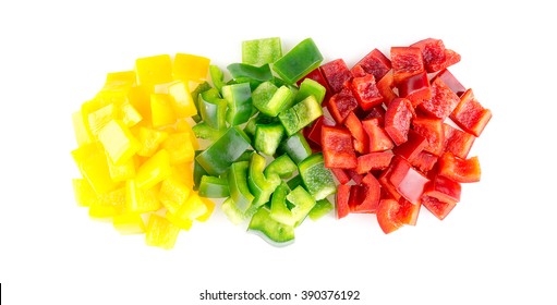 Aerial view of tasty raw yellow green and red bell peppers against white background