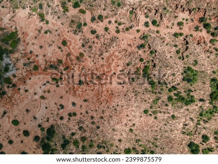 Similar – Image, Stock Photo Aerial view of intricate patterns created by natural erosion in the desert landscape of Utah, showcasing a network of ridges and grooves with varying shades of brown and gray